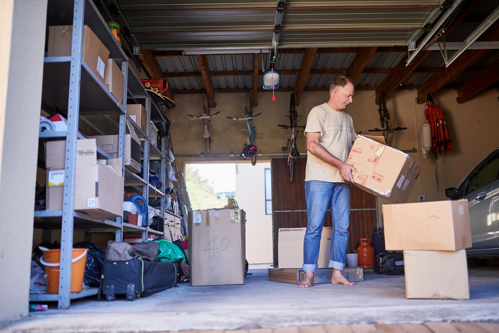 Team member carrying a box during a house clearance